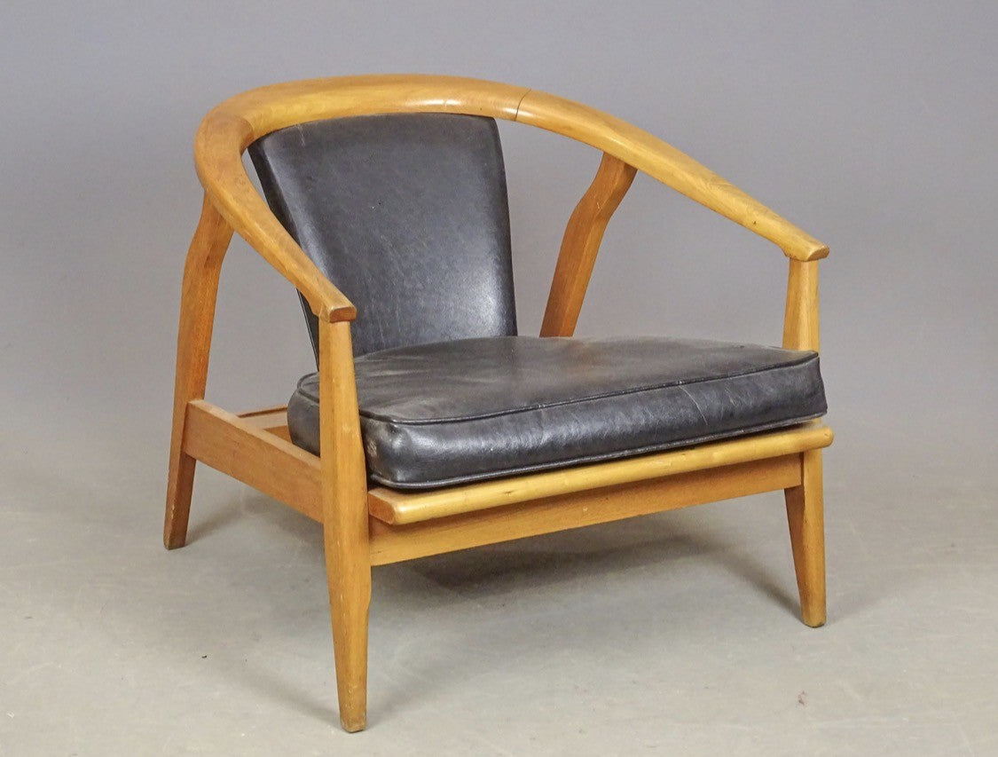 Mid-century barrel back lounge chair, side view