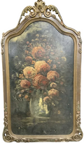 Floral painting in a decorative gold frame on a black background